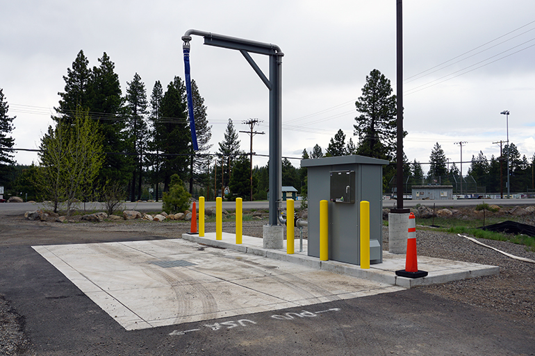 A custom Portalogic FS-72 Bulk Water Fill Station in Truckee, CA allows haulers to choose between an overhead fill point or a side fill point.