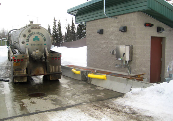 A septic truck ready to use the Portalogic DS-200 Waste Dump Station in Anchorage, Alaska