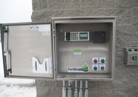 A view of the Portalogic DS-200 Waste Dump Station, featuring a card reader and proximity card reader